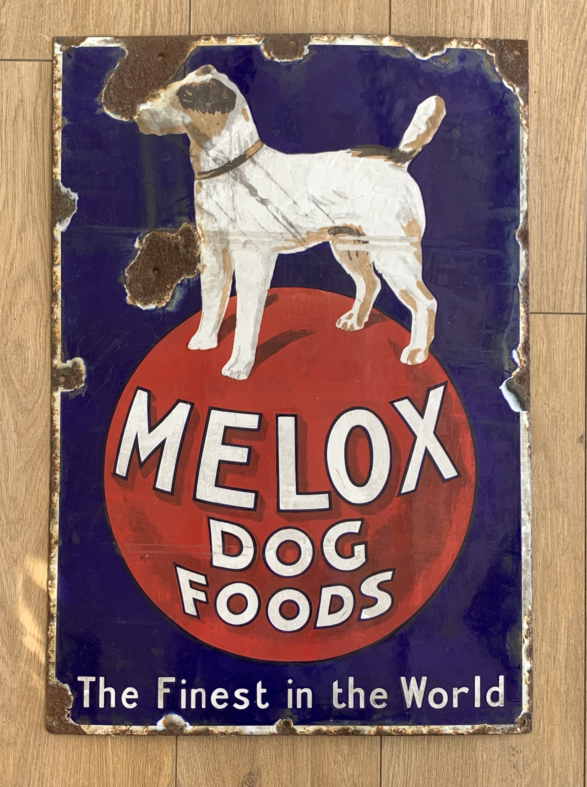 A vintage glass enamelled sign advertising "Melox Dog Foods", 66 x 46 cm