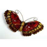 An early George V basse-taille enamelled silver butterfly brooch, with orange and red wings, shape