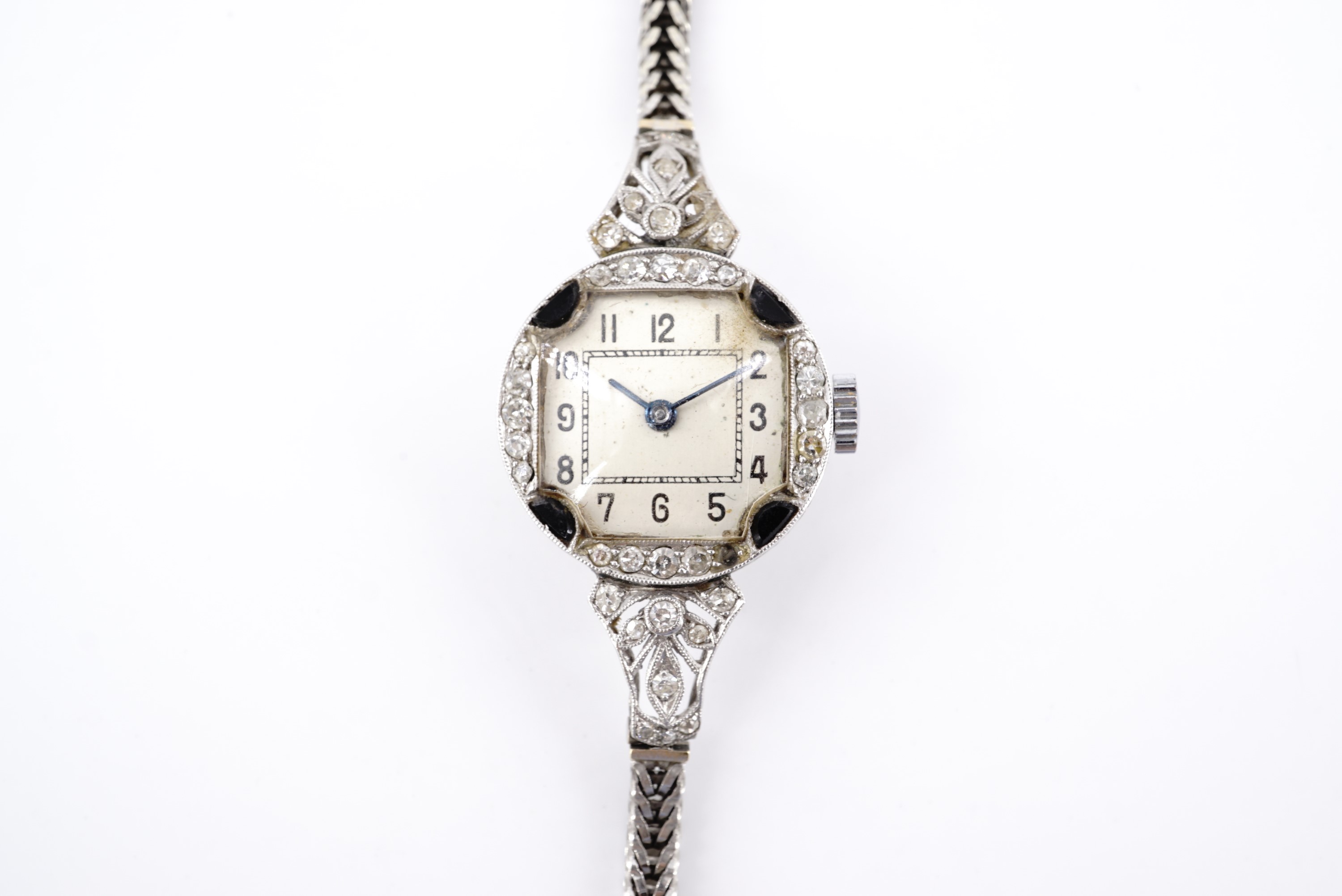 A 1920s Art Deco platinum, diamond and blue stone cocktail watch, having a Swiss 17 jewel movement