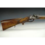 An 18th Century German flintlock sporting rifle, the 70 cm barrel octagonal for half its length,