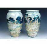 A pair of Grimwades Byzanta Ware fairy lustre vases, each of shouldered ovoid form, each depicting