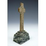 An Alexander Ritchie statuette of St Martin's Cross, modelled in brass, on a green Iona marble