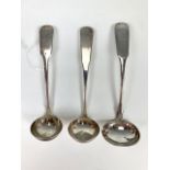 Three antique Scottish Provincial silver sauce ladles, fiddle pattern, two having engraved
