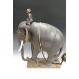 A 1930s Malayan elephant sculpture of carved wood, depicting a naturalistically modelled elephant