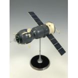 A scale model of a Russian Soyuz spacecraft, high density plastic or plasti-coated alloy, on