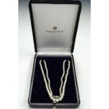 A Mikimoto single-strand necklace of graded pearls, with white-metal marcasite box clasp, largest
