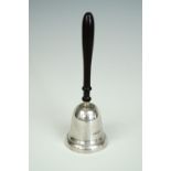 A silver table bell, having a turned wooden handle, late 20th Century, 13.5 cm