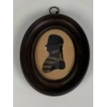 An early 19th Century bronzed silhouette of Major F Stupart, The Scots Greys, in oval ebonised and