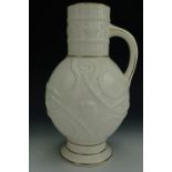 A late Victorian ivory glazed vase or flower jug, of oblate form with a cylindrical neck and