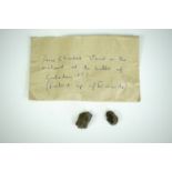 Two small rock fragments in an envelope inscribed "Prince Charlie stood on the enclosed at the