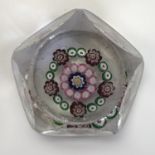 A 19th Century glass paperweight in the manor of Baccarat, containing concentric millefiori wreaths,