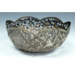 A 19th Century Chinese export white metal bowl, circular with a cusped rim, pierced, repousse-worked
