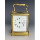 An antique brass corniche-cased carriage clock by J Ritchie and Son, Paris, of diminutive stature,