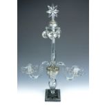 A late Georgian facet-cut glass candelabrum, incomplete, with parts of one other, 68 cm