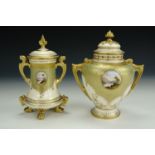Two Coalport porcelain vases and covers, uniformly decorated, one of shouldered form, the other of