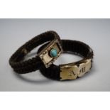 Two Victorian hairwork mourning rings, each having a yellow metal face, one bezel set with a