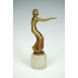 An Art Deco bronzed statuette of a young lady, modelled in a crouched position with outstretched