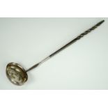 A George III white metal punch ladle, having a baleen handle, bearing engraved initials and date