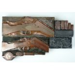 A group of Victorian copper printing blocks depicting shotguns, cartridges etc
