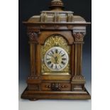 A late 19th Century walnut cased mantle clock by Junghans, 49 cm