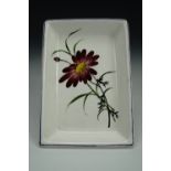 A Plichta Wemyss Ware dish, of rectangular section, decorated with a red daisy, printed marks,