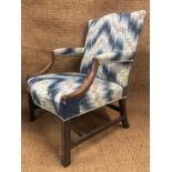 A George III mahogany Gainsborough armchair