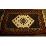 A large Tunisian rug, 240 cm x 148 cm