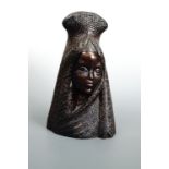 A resin bust of a woman in traditional dress, 30 cm