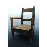 A rustic 19th Century child's armchair, 42 cm