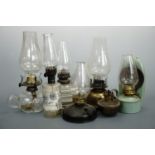 Victorian and later glass, enamelled and tinplate finger and other oil lamps