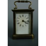 An early 20th Century French carriage clock, 10.5 cm excluding handle