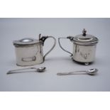 Two silver mustard pots , each having a cobalt blue glass liner and spoon