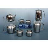 An Old Hall "Connaught" pattern bright stainless steel tea set in original packaging, together