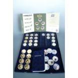 A quantity of QEII commemorative coins, cases and certificates