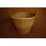 A woven wicker log basket, 35 x 46 cm