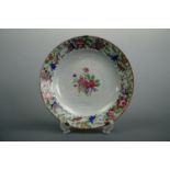 An 18th Century Chinese export famille rose dish, 22 cm