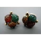 A pair of vintage Tut-mania period screw-back earrings, each set with a trio of scarab-shaped carved