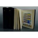Three Davo stamp albums containing an extensive collection of franked and unfranked definitive and