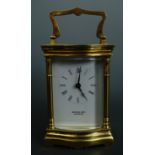A contemporary carriage clock, retailed by Michael King of Curthwaite, 12 cm excluding handle