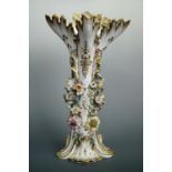 A William IV / early Victorian Rockingham style floral-encrusted porcelain vase, (a/f), 37 cm