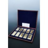 A cased gold plated United States dollar ingots set