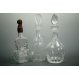 An Edinburgh cut glass decanter together with another decanter and a novelty Austrian bottle,