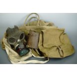 A Second World War Home Guard haversack, leather anklets, a Civilian Duty respirator and ATS kit