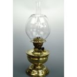A late 19th century brass duplex oil lamp with free blown globe, 50 cm