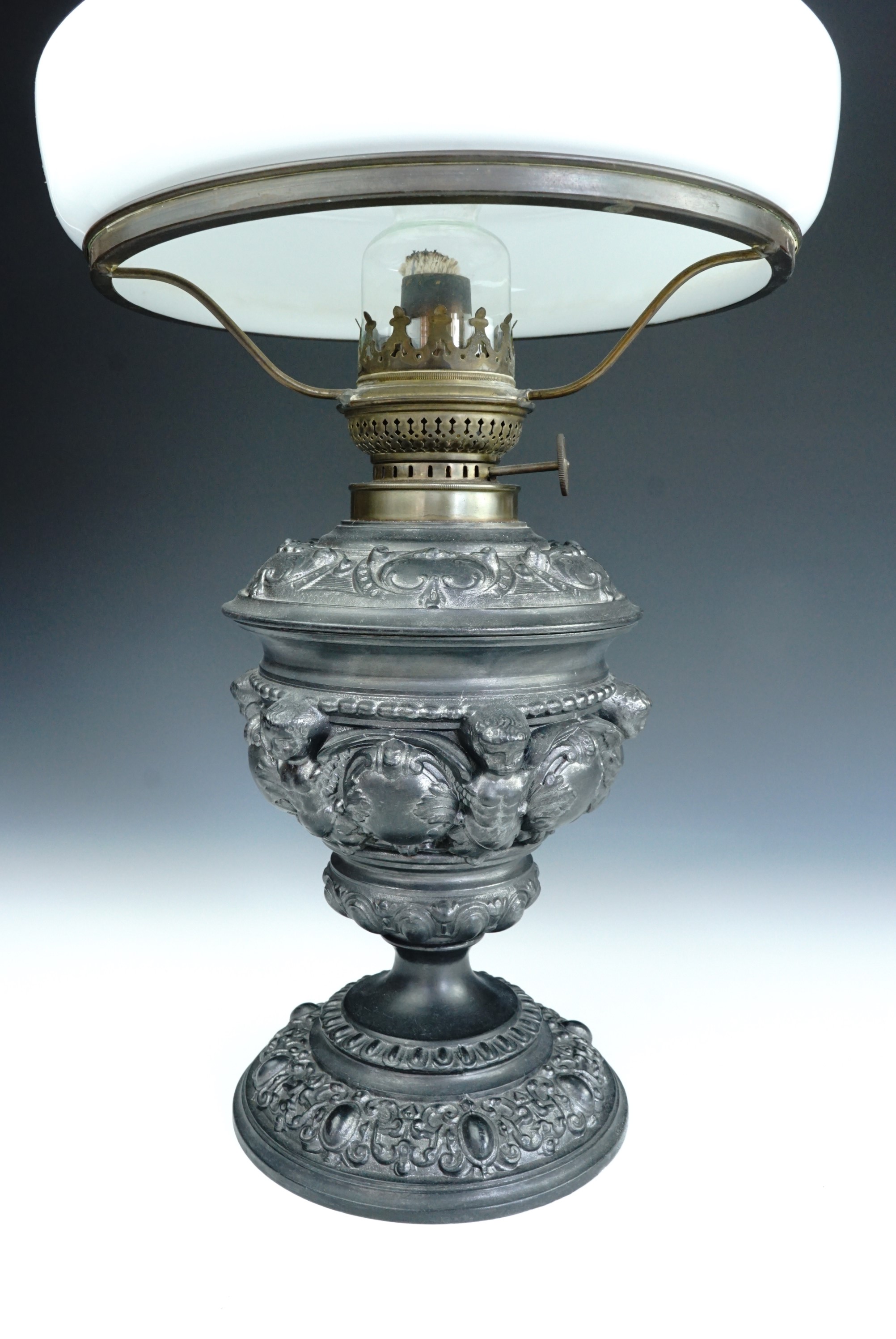 An antique German Kosmos Brenner Baroque style base metal oil lamp, the base incorporating winged - Image 3 of 4