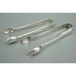 A set of Edwardian silver sugar tongs by Josiah Williams & Co, together with a set of electroplate