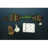 Georgian and later ladies' and pocket accoutrements comprising a smelling salts bottle and purse,