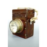 An early 20th Century mahogany-cased electric torch / hand lantern, 14 cm