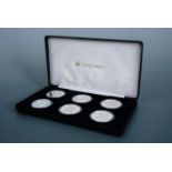 A cased group of silver proof five pounds royal commemorative coins