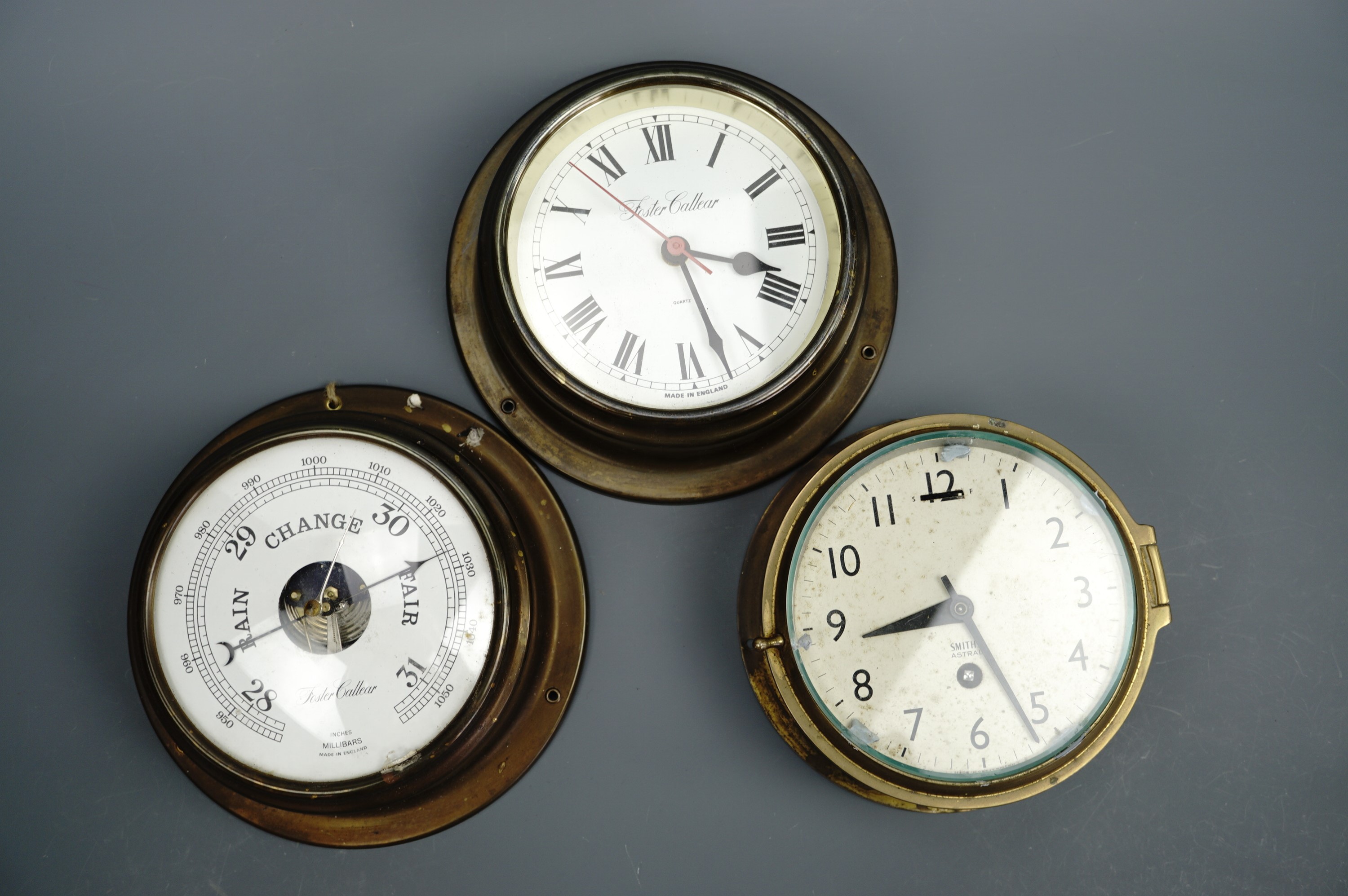 A Smith's Astral marine bulkhead clock, second quarter 20th Century, together with a Foste Callear